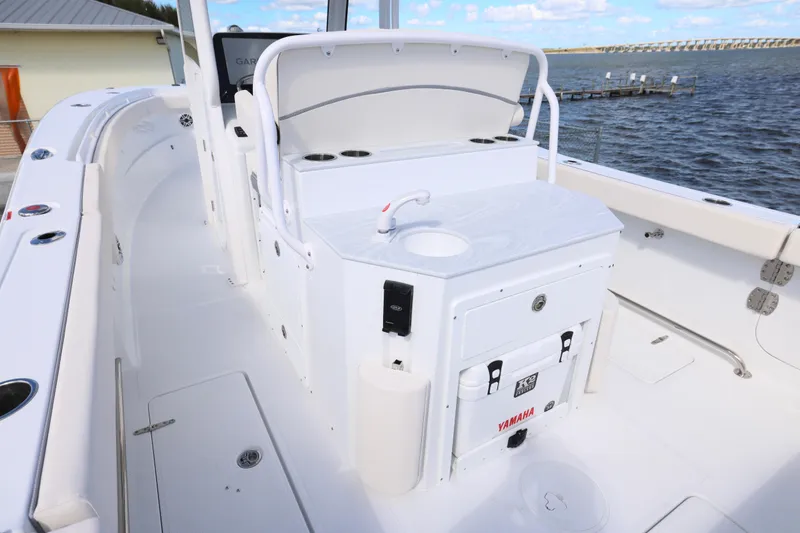 Slide: The Image of 2026 Sea Hunt Ultra 275 Coffin Box boat interior with sink and storage. - 15
