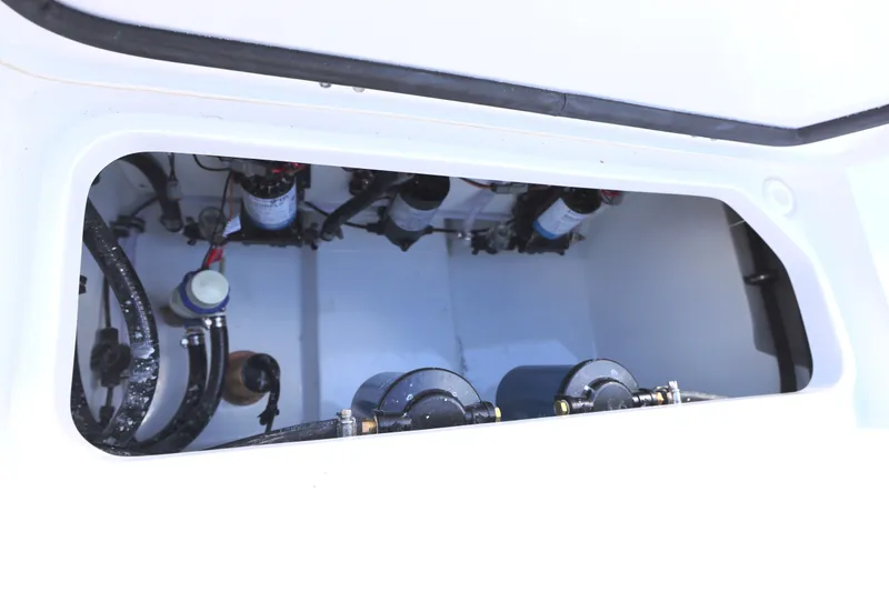 Slide: The Image of 2026 Sea Hunt Ultra 275 Coffin Box interior view, showcasing mechanical components. - 17