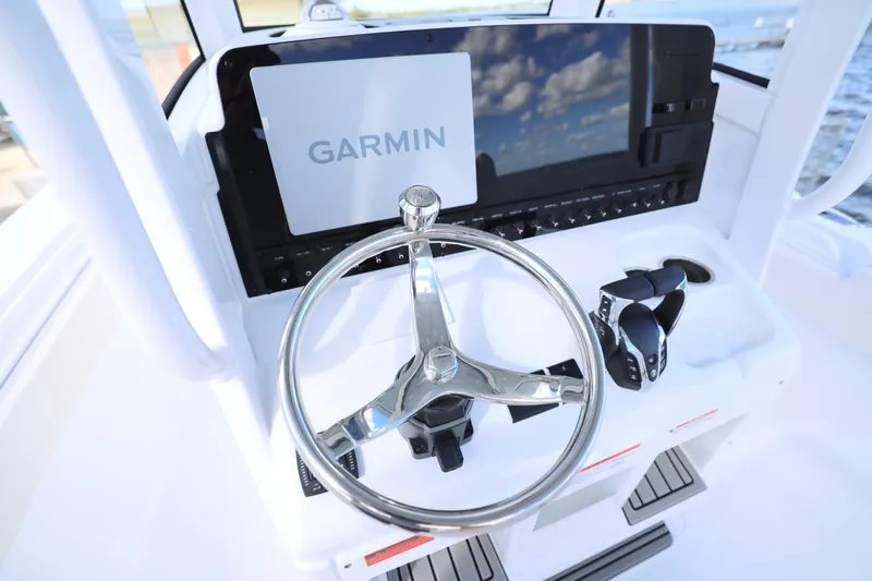 Slide: The Image of Steering console of 2026 Sea Hunt Ultra 275 Coffin Box with Garmin display. - 18