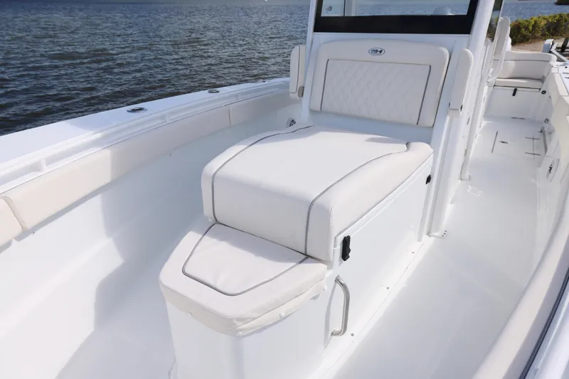 Slide: The Image of 2026 Sea Hunt Ultra 275 Coffin Box boat interior with cushioned seating. - 3