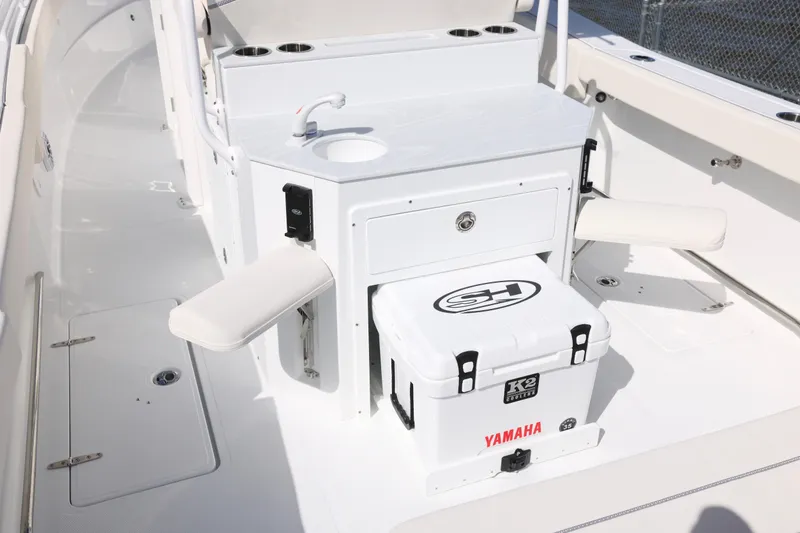 Slide: The Image of 2026 Sea Hunt Ultra 275 Coffin Box interior with sink and Yamaha cooler. - 4