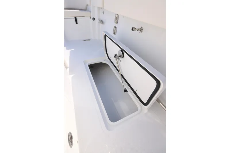 Slide: The Image of 2026 Sea Hunt Ultra 275 Coffin Box open, showcasing spacious storage compartment. - 8