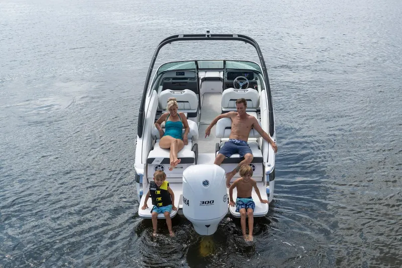 Slide: The Image of Manufacturer Provided Image: Family enjoying a day on a 2026 Regal LX4 boat in calm waters. - 3