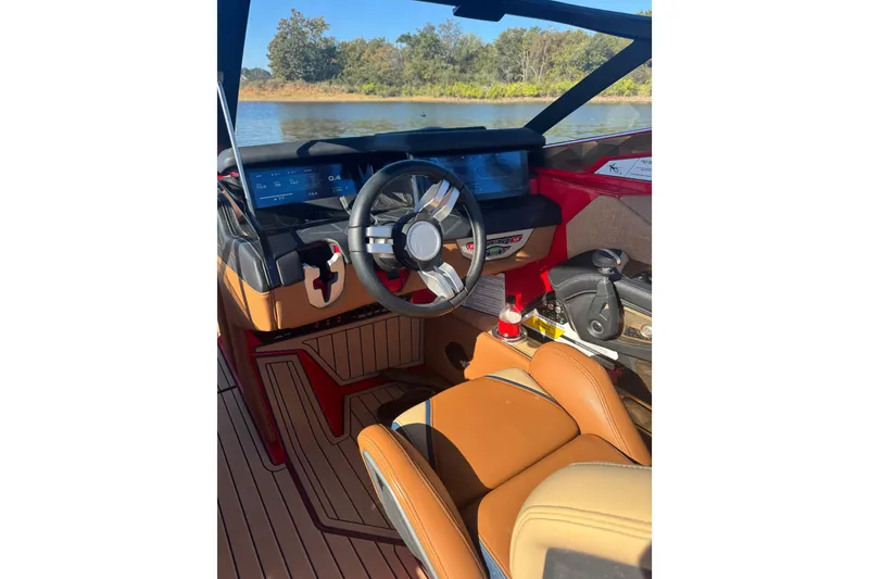 Slide: The Image of Open storage compartment in 2021 Nautique Super Air Nautique G23 Paragon boat. - 7