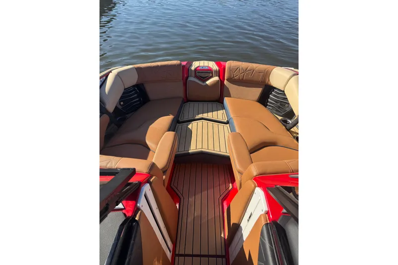 Slide: The Image of 2021 Nautique Super Air Nautique G23 Paragon interior with tan leather seating and geometric design. - 8