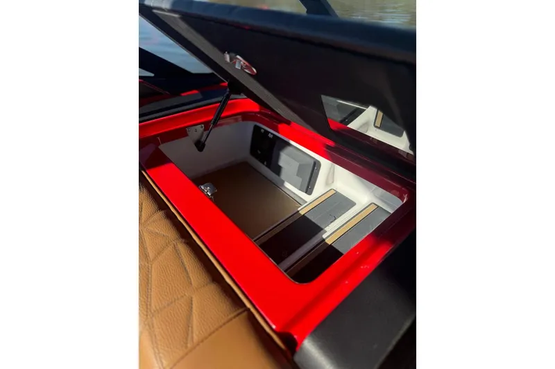 Slide: The Image of 2021 Nautique Super Air Nautique G23 Paragon interior with tan leather seating. - 9