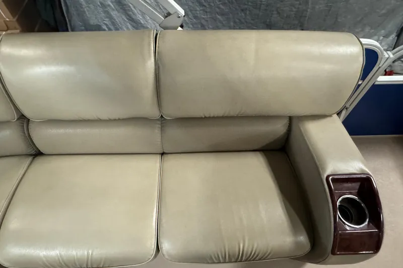 Slide: The Image of Beige leather seating with cup holder on SunCatcher Elite 322 Cruise, 2014 model. - 13