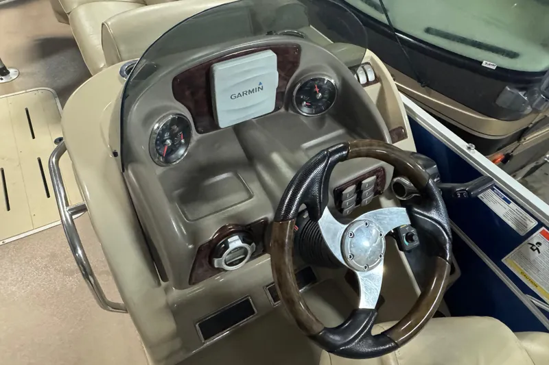 Slide: The Image of Steering console of 2014 SunCatcher Elite 322 Cruise with Garmin navigation system. - 14