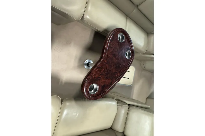 Slide: The Image of Luxurious interior of 2014 SunCatcher Elite 322 Cruise with elegant wood table and cup holders. - 7