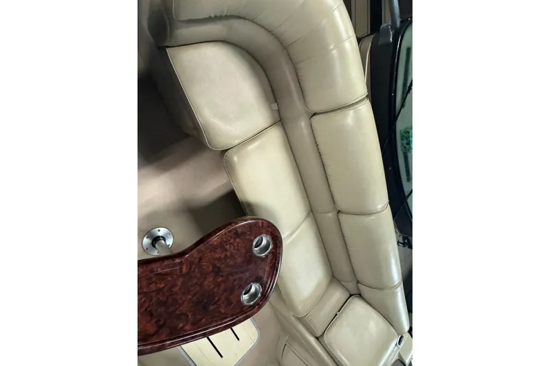 Slide: The Image of Luxurious beige seating on 2014 SunCatcher Elite 322 Cruise boat with wooden table. - 8