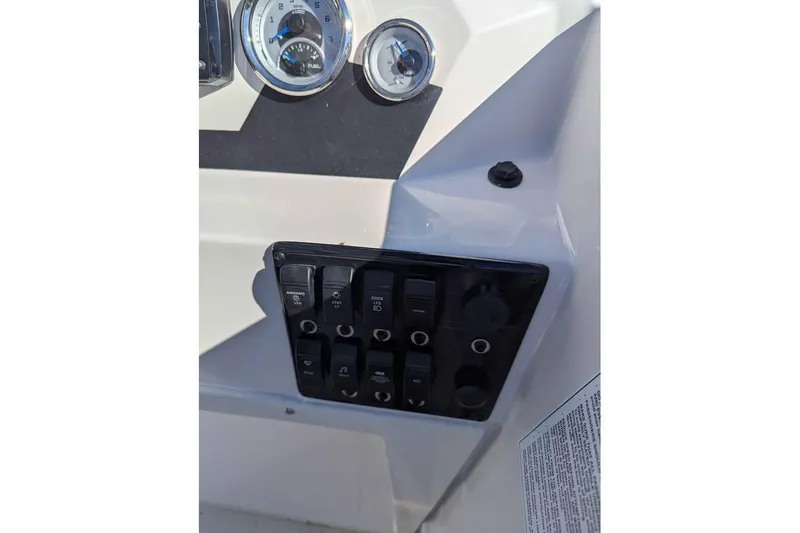 Slide: The Image of Control panel of 2026 Starcraft SVX 171 OB boat with gauges and switches. - 10