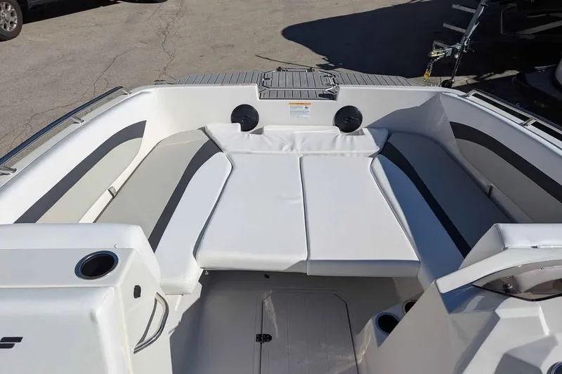 Slide: The Image of 2026 Starcraft SVX 171 OB boat interior with white cushioned seating. - 12