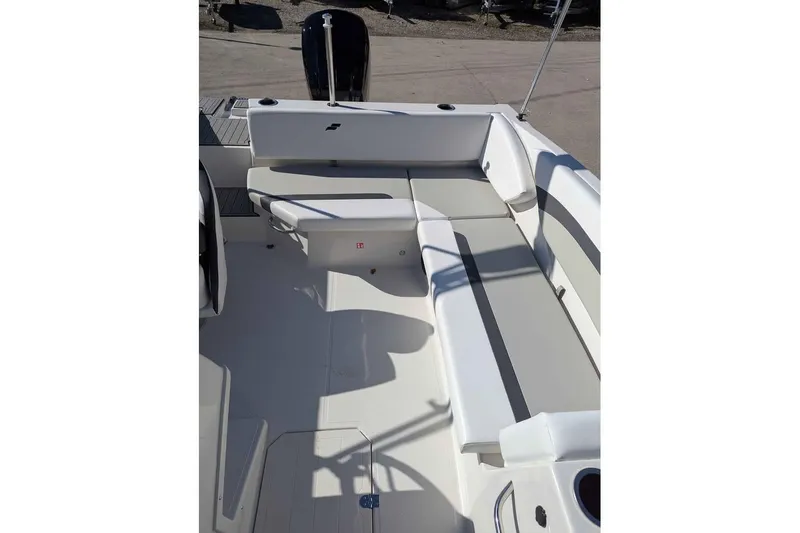 Slide: The Image of 2026 Starcraft SVX 171 OB boat interior with white and gray seating arrangement. - 14