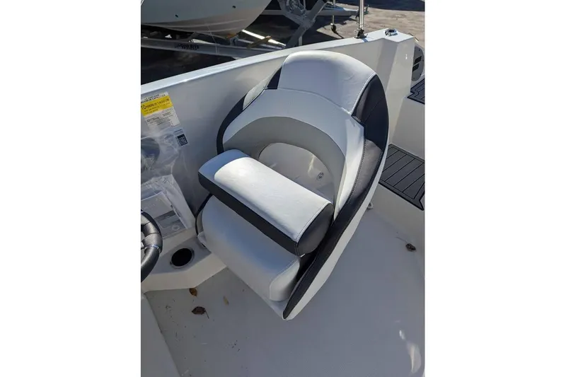 Slide: The Image of Captain's seat on 2026 Starcraft SVX 171 OB boat, featuring sleek design and comfortable padding. - 15