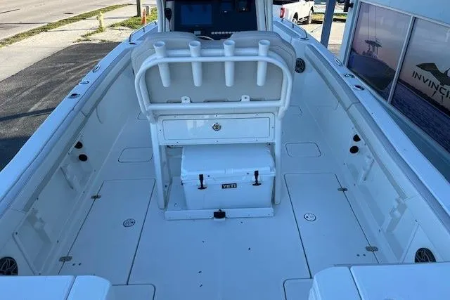 Slide: The Image of 2026 World Cat 235 TE boat interior with rod holders and Yeti cooler. - 10
