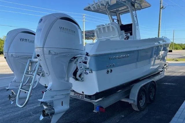 Slide: The Image of 2026 World Cat 235 TE boat with twin Yamaha engines on a trailer. - 3