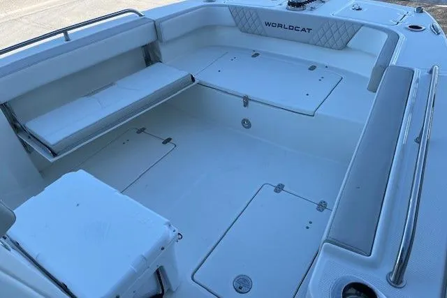 Slide: The Image of 2026 World Cat 235 TE boat interior with seating and storage compartments. - 5