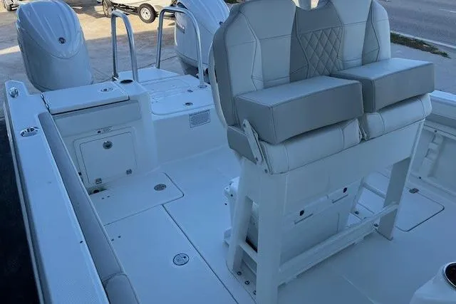Slide: The Image of 2026 World Cat 235 TE boat interior with dual seating and storage compartments. - 6