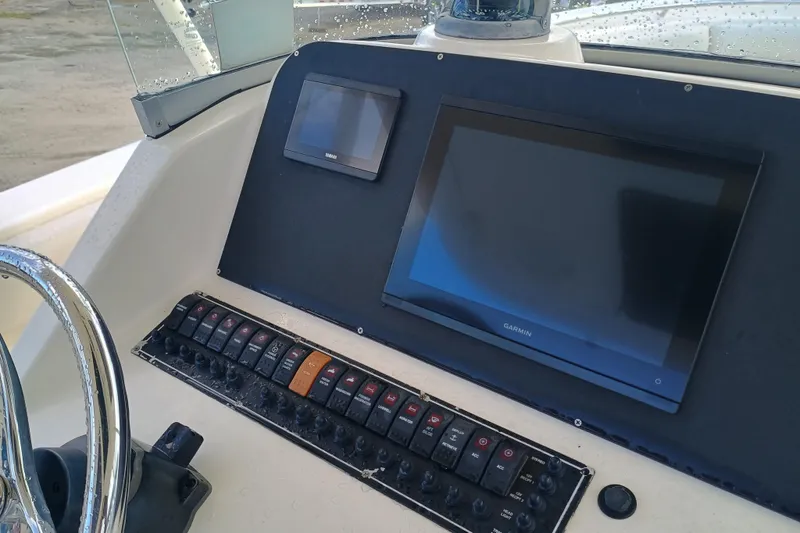 Slide: The Image of Control panel of 2010 Pursuit S 280 Sport boat with Garmin display. - 12