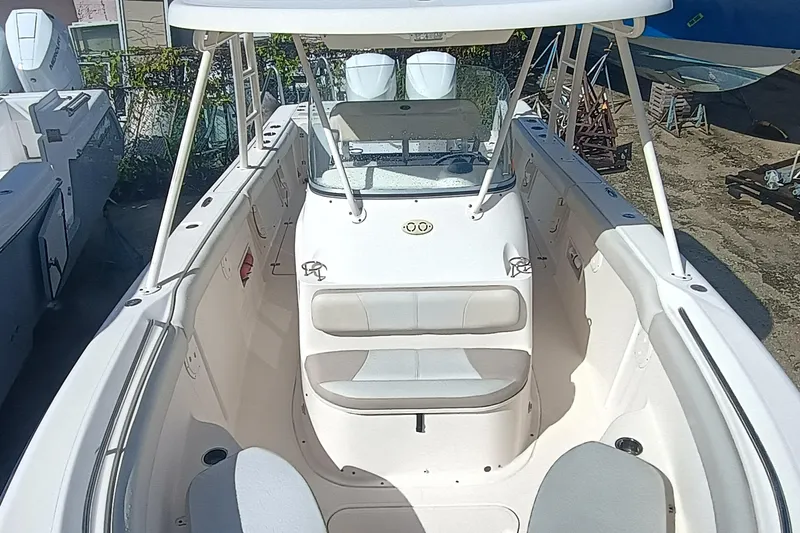 Slide: The Image of 2010 Pursuit S 280 Sport boat interior with seating and console, viewed from above. - 16