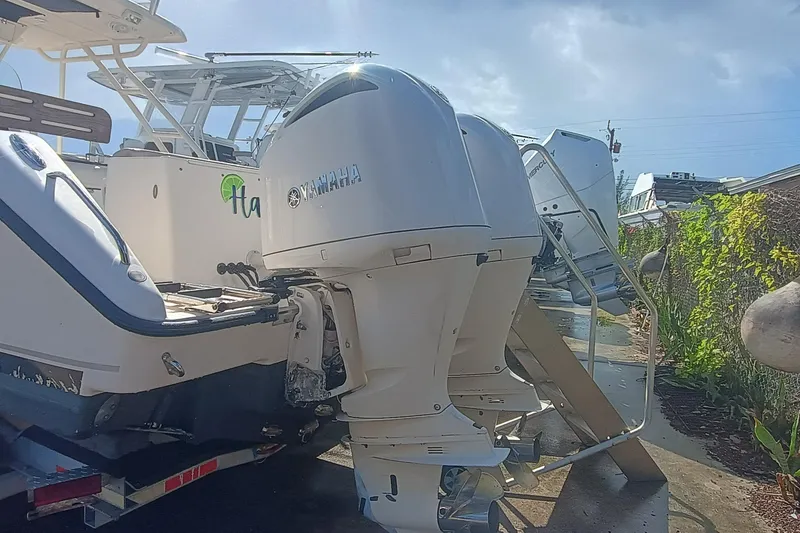 Slide: The Image of 2010 Pursuit S 280 Sport boat with Yamaha outboard engines, parked outdoors. - 5