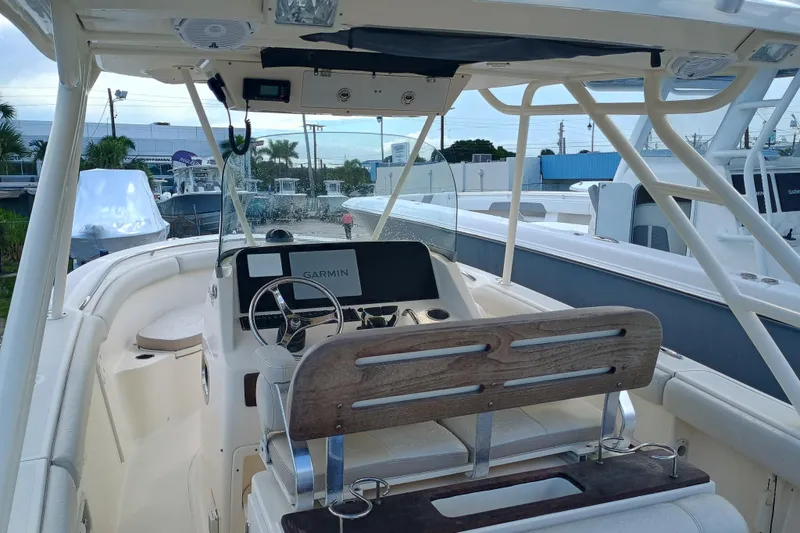 Slide: The Image of 2010 Pursuit S 280 Sport boat interior with Garmin navigation system and seating. - 7