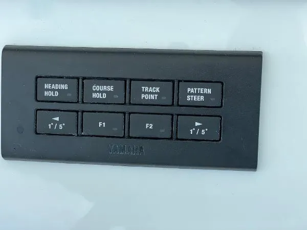 Slide: The Image of Control panel of a 2021 Regulator 34 boat with navigation buttons. - 18