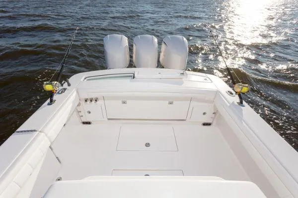 Slide: The Image of 2021 Regulator 34 boat with triple engines on open water. - 9