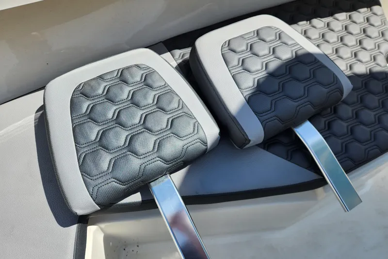 Slide: The Image of 2025 May-Craft 245 Offshore CC boat seats with hexagonal pattern and sleek design. - 10