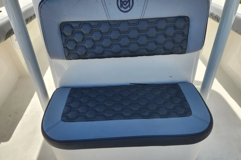 Slide: The Image of 2025 May-Craft 245 Offshore CC boat seat with hexagonal pattern design. - 11