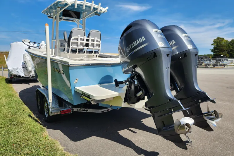 Slide: The Image of 2025 May-Craft 245 Offshore CC boat with twin Yamaha engines on a trailer. - 4