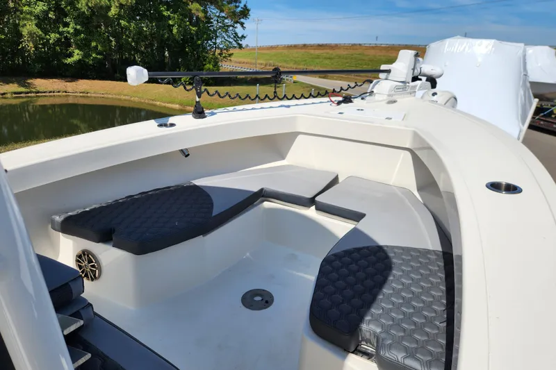 Slide: The Image of 2025 May-Craft 245 Offshore CC boat interior with cushioned seating and modern design. - 9