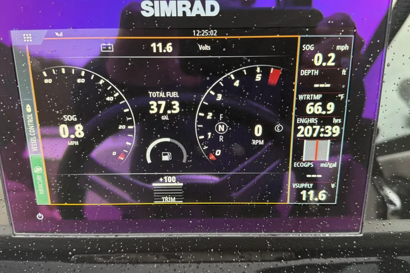 Slide: The Image of Simrad display on 2021 Sea Ray SDX 250 showing speed, fuel, and engine data. - 11