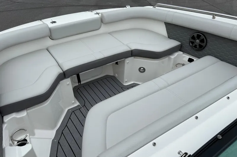 Slide: The Image of 2021 Sea Ray SDX 250 boat interior with cushioned seating and speaker. - 13