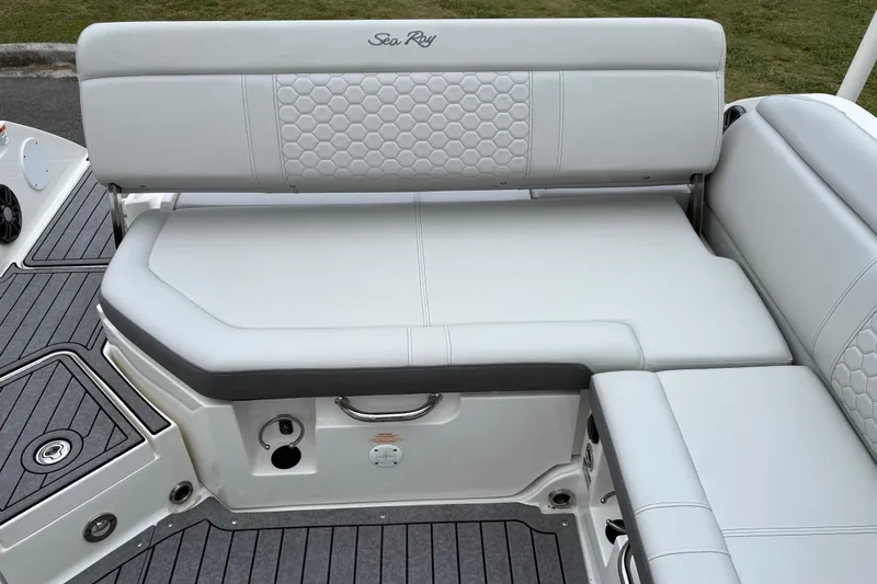 Slide: The Image of 2021 Sea Ray SDX 250 boat seating with white upholstery and hexagonal pattern. - 7