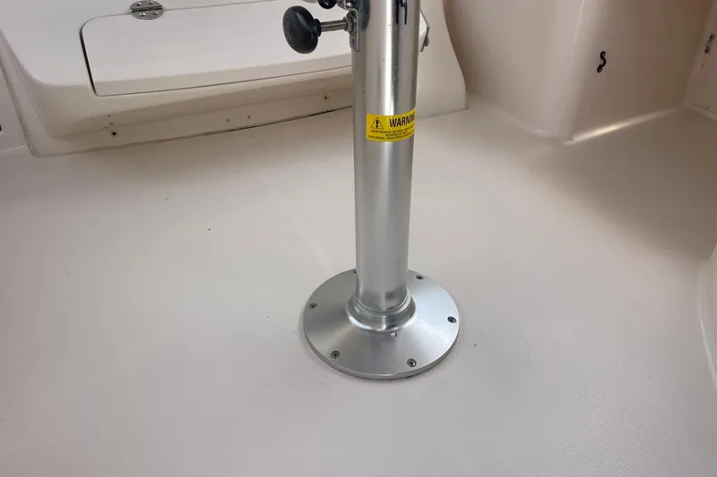 Slide: The Image of Boat interior of 2003 Grady-White Express 330, featuring a metal pedestal base. - 13