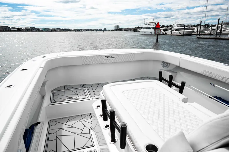 Slide: The Image of 2024 Front Runner 37 Catamaran interior with modern design, docked in a marina. - 10