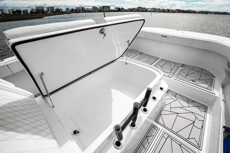 Slide: The Image of 2024 Front Runner 37 Catamaran with open storage compartment and stylish deck design. - 11