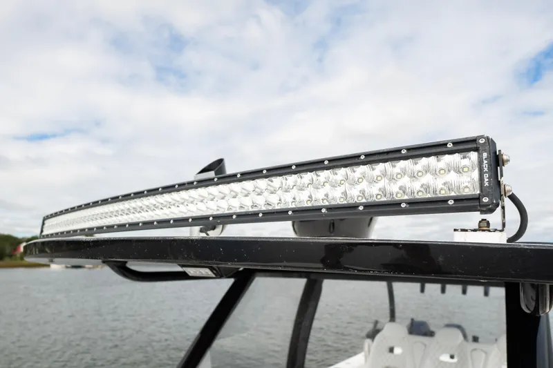 Slide: The Image of LED light bar on 2024 Front Runner 37 Catamaran, with water and sky background. - 12