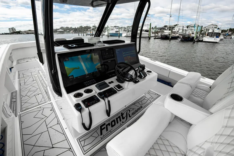 Slide: The Image of 2024 Front Runner 37 Catamaran cockpit with advanced navigation system and luxurious seating. - 15