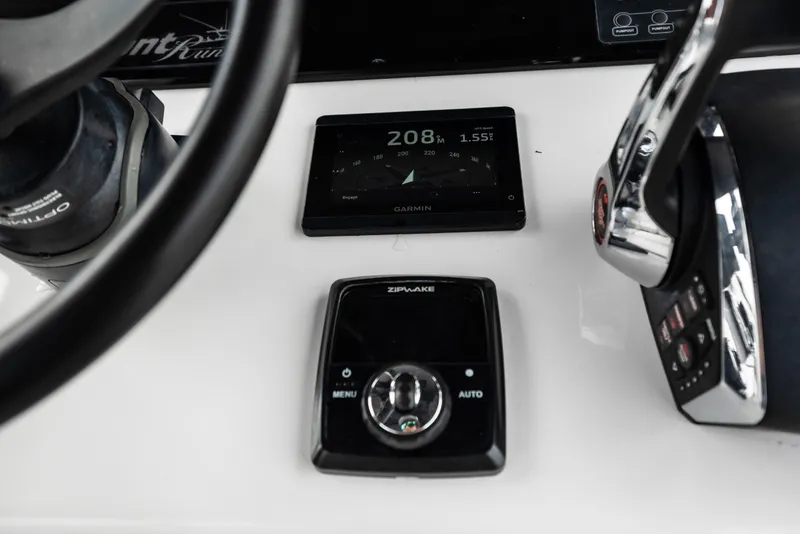 Slide: The Image of Control panel of 2024 Front Runner 37 Catamaran with Garmin and Zipwake systems. - 19