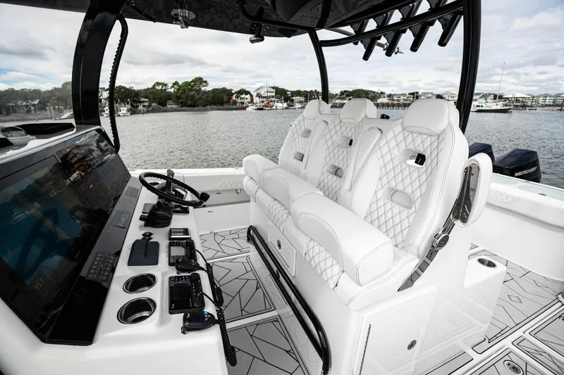 Slide: The Image of 2024 Front Runner 37 Catamaran interior with luxurious seating and advanced controls. - 20