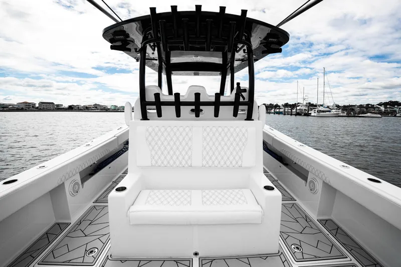 Slide: The Image of 2024 Front Runner 37 Catamaran interior with sleek seating and modern design on the water. - 21