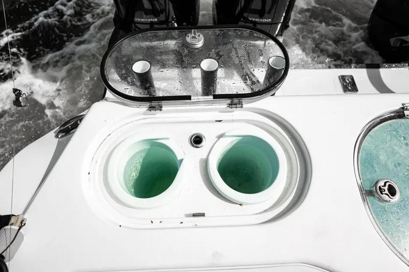 Slide: The Image of Livewell on 2024 Front Runner 37 Catamaran, featuring dual compartments and rod holders. - 24