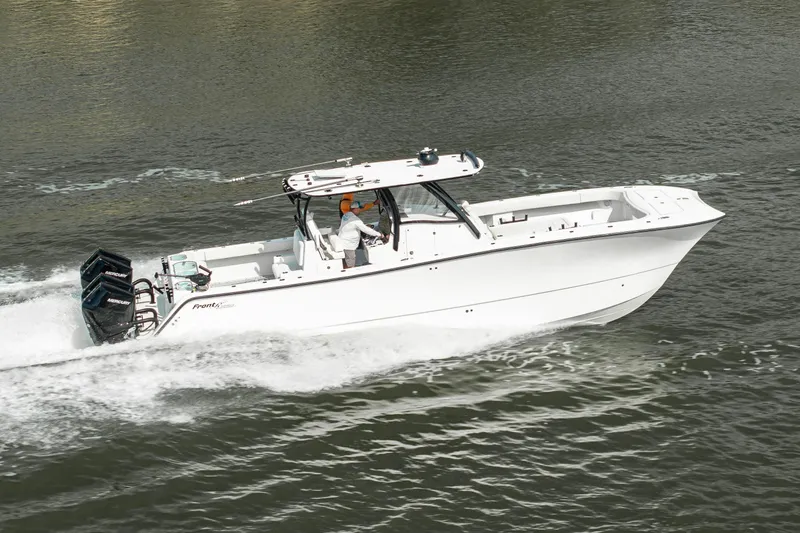 Slide: The Image of 2024 Front Runner 37 Catamaran cruising on water, showcasing sleek design and powerful engines. - 3