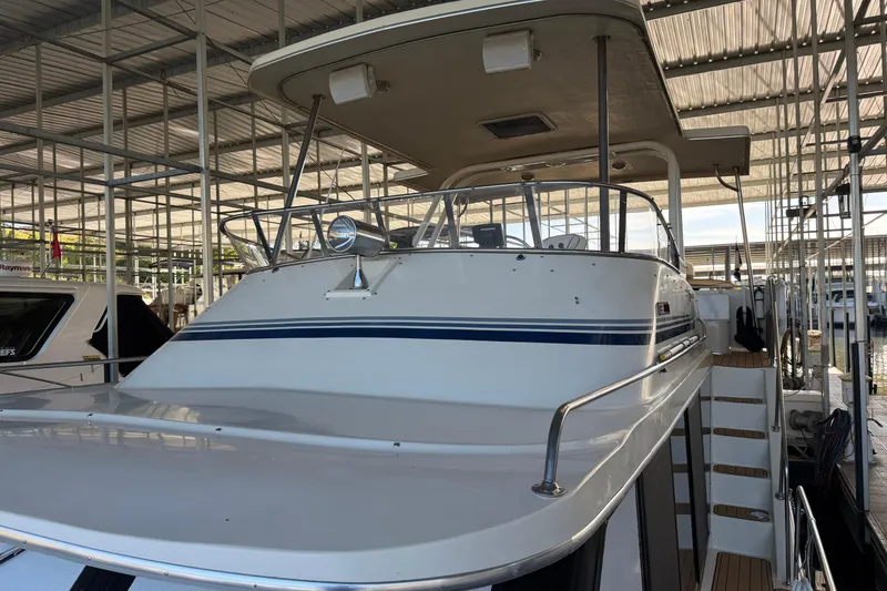 Slide: The Image of 1990 Blue Water 42 Coastal Cruiser docked in a covered marina. - 14