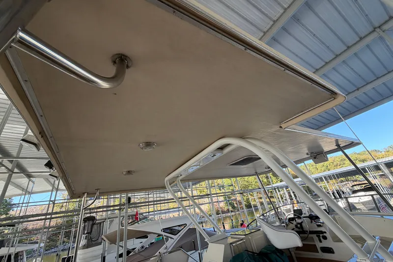 Slide: The Image of 1990 Blue Water 42 Coastal Cruiser boat interior with metal railings and seating. - 15