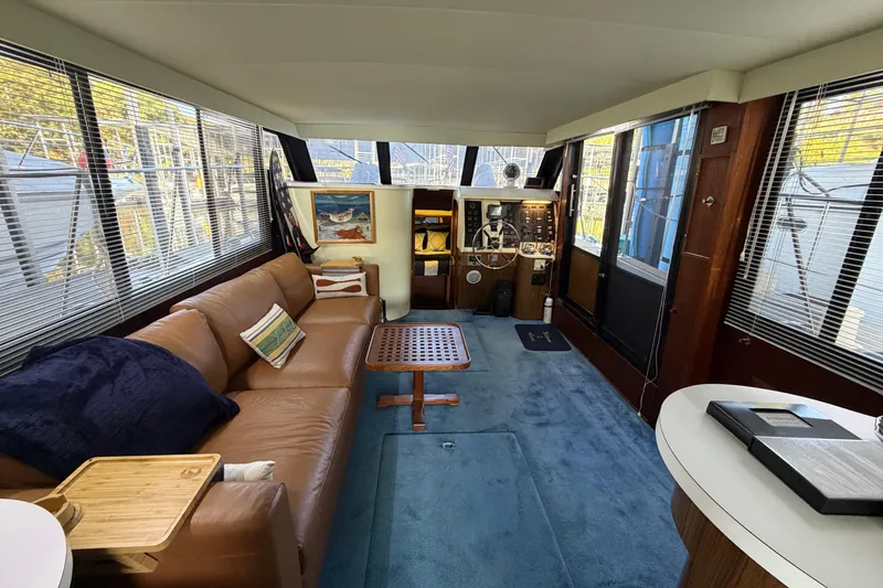 Slide: The Image of Interior of 1990 Blue Water 42 Coastal Cruiser with leather sofa and helm station. - 32