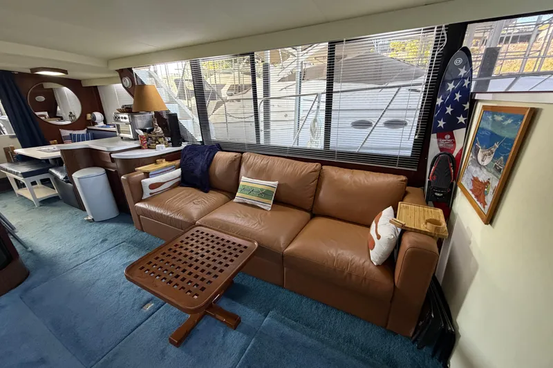 Slide: The Image of Interior of 1990 Blue Water 42 Coastal Cruiser with leather sofa and nautical decor. - 33