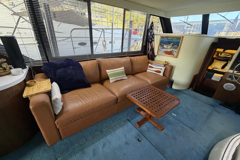 Slide: The Image of Interior of 1990 Blue Water 42 Coastal Cruiser with leather sofa and nautical decor. - 34